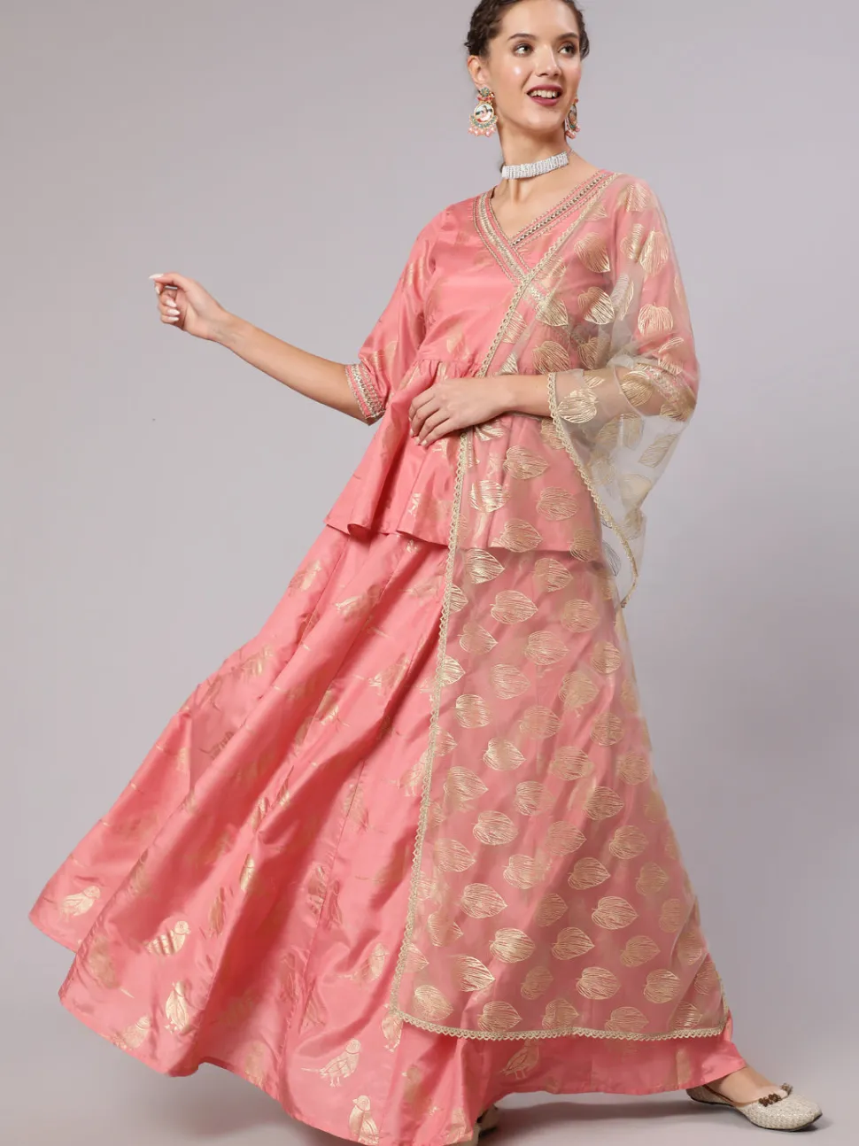 Jaipur Kurti A Peach Color Bird Printed Silk Blend Peplum Top And Skirt With A Gold Print Net Dupatta